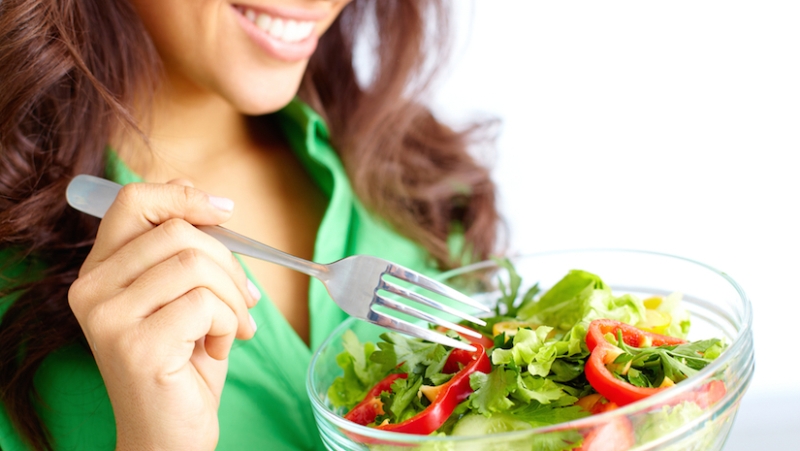 A Bowl Of Fresh Fruits And Vegetables Holding By A Woman.