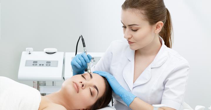 Woman Getting Facial Laser Treatment.