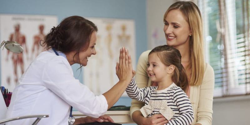 A Small Kid And Her Mother While Visiting A Dermatologist.