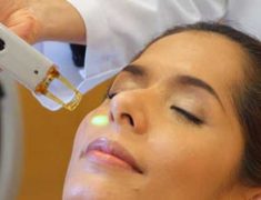Woman Getting Facial Peeling Treatment At Cosmetic Beauty Spa Clinic.