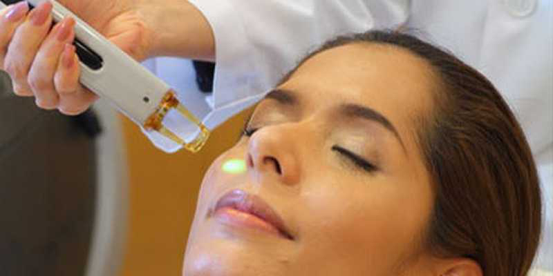 Woman Getting Facial Peeling Treatment At Cosmetic Beauty Spa Clinic.