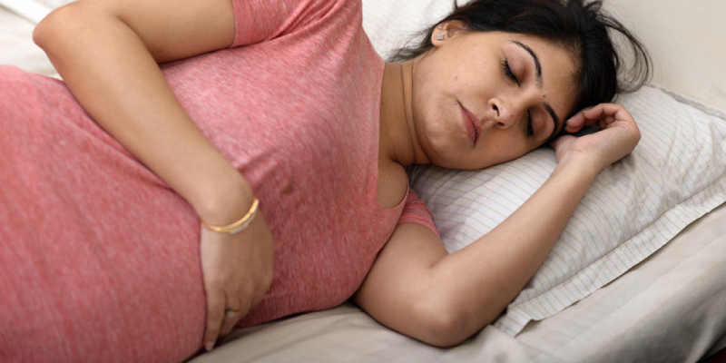 A Pregnant Woman In A Deep Sleep.