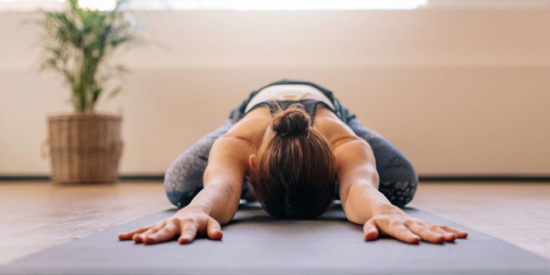 A Woman Doing Exercise To Get Rid of Lower Back Pain.