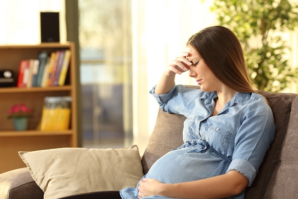 A Pregnant Woman Suffers By A Severe Headache.