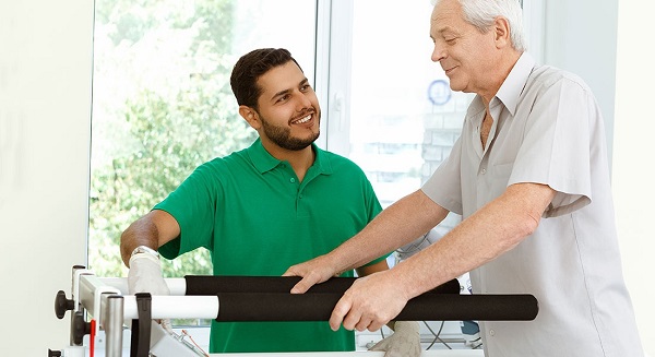 A Physiotherapist Treats His Senior Patient.