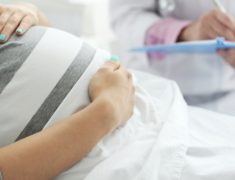 A Pregnant Woman taking Health Insurance.