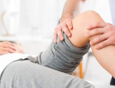 A Physiotherapist Give Knee Massage To A Patient