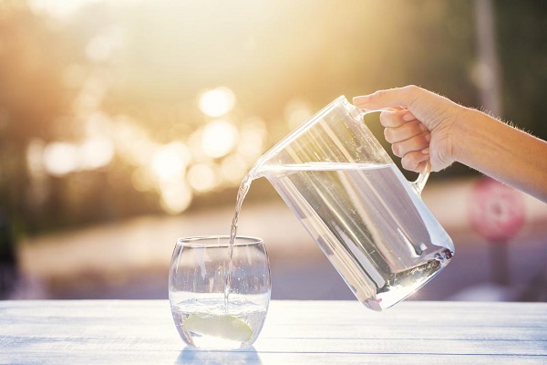 Water Poured Into The Class - Drink Plenty Of Water Concept.