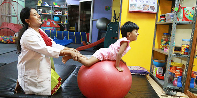 Kid Exercising In Physiotherapy Session.