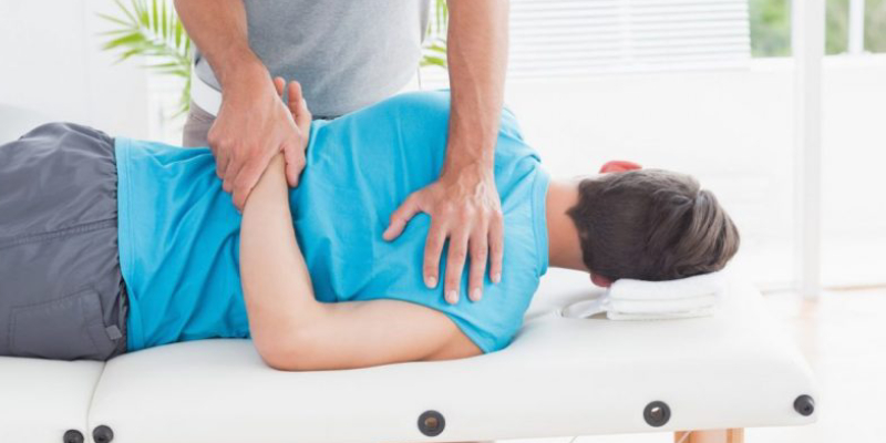 A Woman During Her Physiotherapy Session.